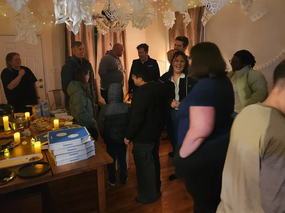 Friends talking at an evening gathering
